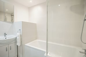 Shower, towels, soap, toilet paper