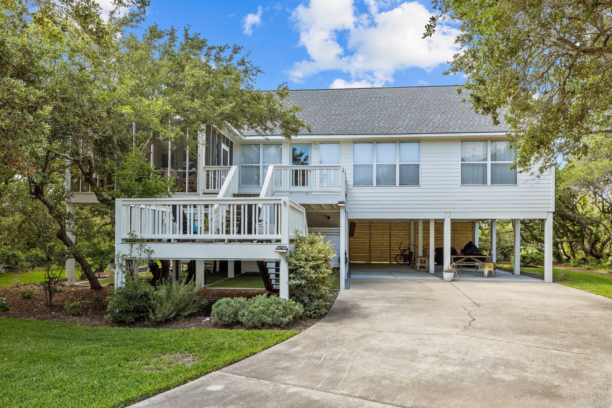 A two-story house with a covered porch and a garage.