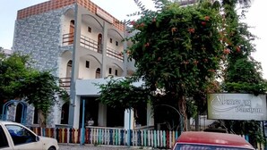 A multi-story building with a stone facade and a balcony. There is a sign with the name "Aksuya Pansiyon" visible. - Akasya Pansiyon & Apart (Anamur)