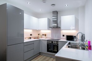 Apartment | Private kitchen | Full-size fridge, microwave, oven, stovetop