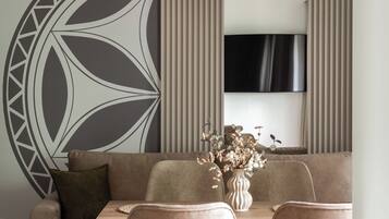 Departamento Deluxe, balcón | Área de sala de estar