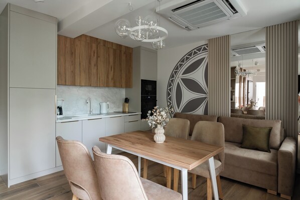 Deluxe Apartment, Balcony | Living area