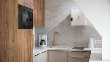 Suite Deluxe, balcon | Coin cuisine privé | Bouilloire électrique