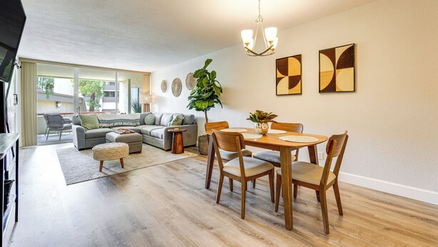 A modern living room with a dining area, a sofa set, a coffee table, and a chandelier. - Walkable Old Town Scottsdale Condo: Pool & Hot Tub (Scottsdale)