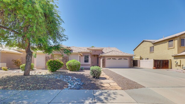 A residential street with houses, a tree, and a clear sky. - 3 Mi to Santan Village: Home w/ Covered Patio (Gilbert)