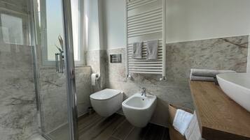 Hair dryer, bidet, towels, soap