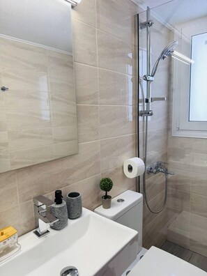 Studio, Garden View | Bathroom | Shower, towels, soap, shampoo - Desire Apartments (Kato Gouves)
