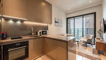 Grand Suite, 1 Bedroom, Club Lounge Access, City View | Private kitchen | Full-size fridge, microwave, oven, stovetop