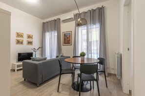 Apartment, 2 Bedrooms, Balcony | Living area | 30-inch TV with satellite channels - La casa sul Mercato by Wonderful Italy (Palermo)