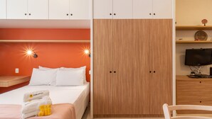 A hotel room with a bed, a wardrobe, a desk, and a television. - 10 Minutes From Copacabana Beach Rc305 (Rio de Janeiro)