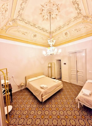 Deluxe Triple Room, Balcony, City View | Living area