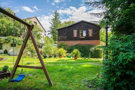 Children’s area. Apartment 'Behling 1 with Terrace' with Shared Terrace, Communal Garden and Wi-Fi