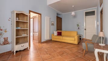 Apartment, Multiple Beds, Balcony | Living area | 30-inch TV with satellite channels