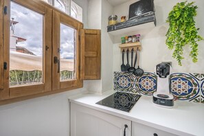 Fridge, microwave, stovetop, coffee/tea maker