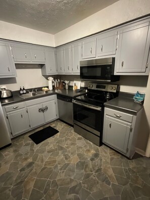 Private kitchen - Welcome to your stylish Nashville retreat, managed by Music City Property Mgmt. (Nashville)