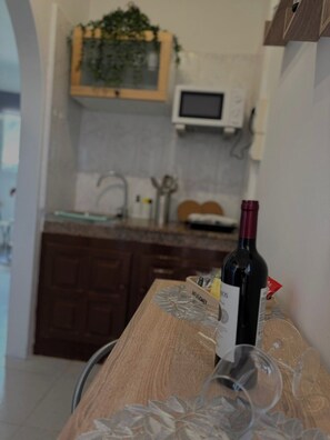 Fridge, microwave, stovetop, coffee/tea maker