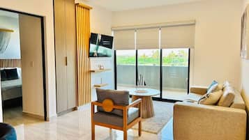 Modern apartment with pool near the beach tower 2 | Living area | Flat-screen TV