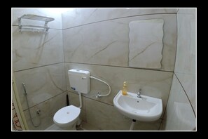 Shower, hair dryer, slippers, towels