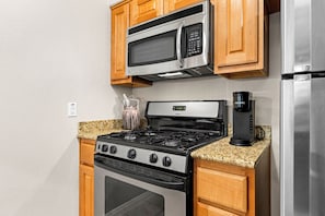 Cookware/dishes/utensils - 
Travis Heights Modern Getaway - Corporate Housing Rental (Austin)