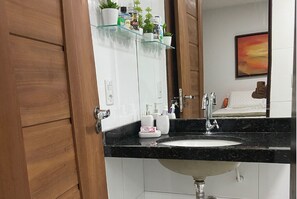 Shower, hair dryer, towels, toilet paper