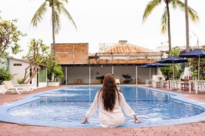 Outdoor pool, open 9:00 AM to 9:00 PM, pool umbrellas, pool loungers