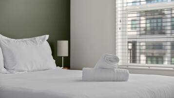 1 bedroom, desk, iron/ironing board, travel crib