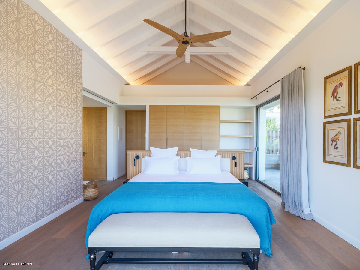 Serene bedroom with balcony and crisp linens