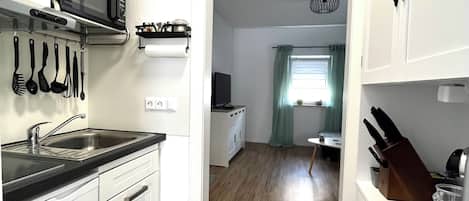 Fridge, microwave, stovetop, coffee/tea maker