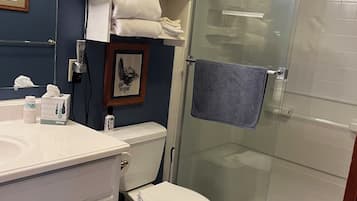 Shower, hair dryer, towels, soap
