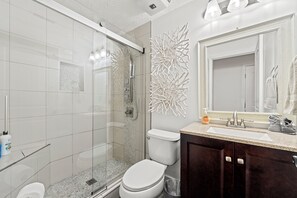 Shower, hair dryer, towels, soap