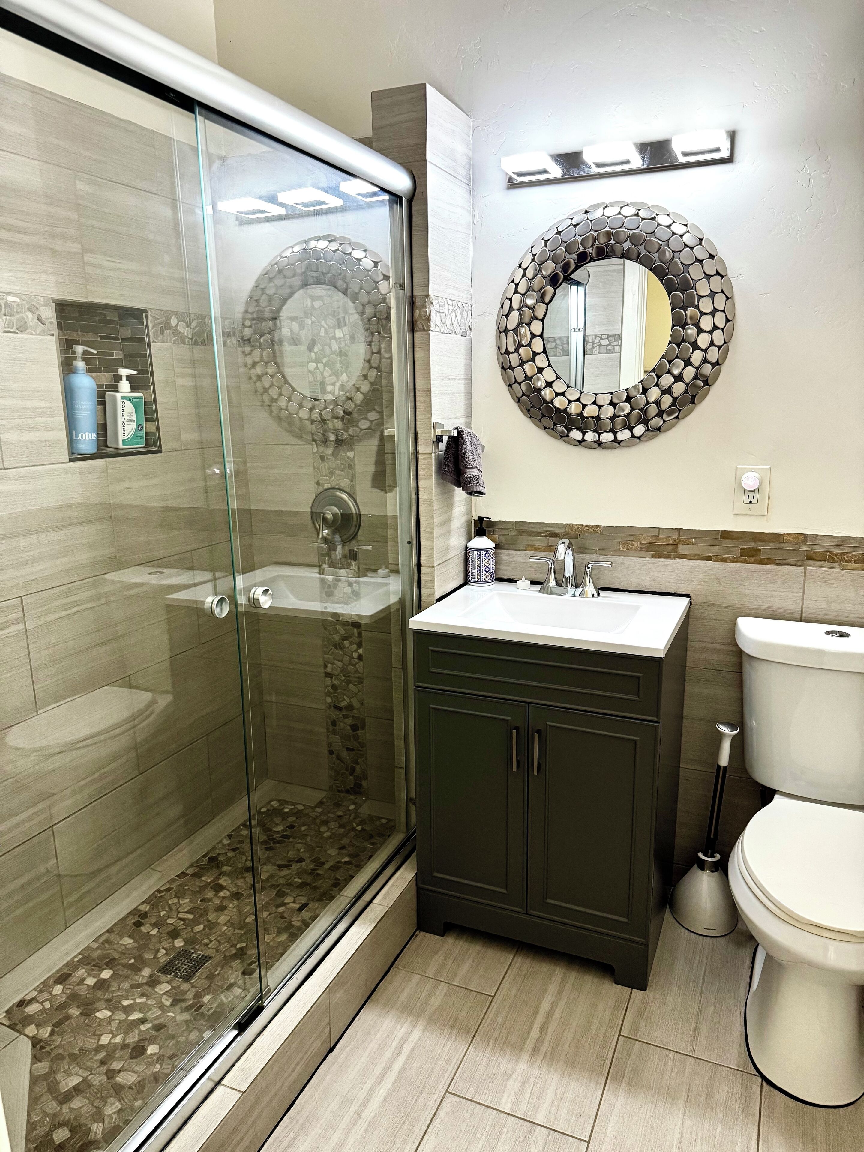 Shower, hair dryer, towels, soap
