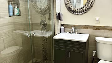 Shower, hair dryer, towels, soap