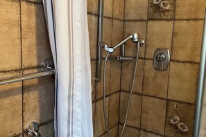 Shower, towels, soap, toilet paper