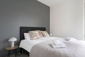 1 bedroom, desk, iron/ironing board, travel crib