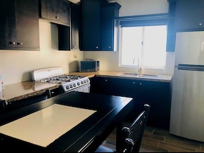 Microwave, oven, coffee/tea maker, cookware/dishes/utensils