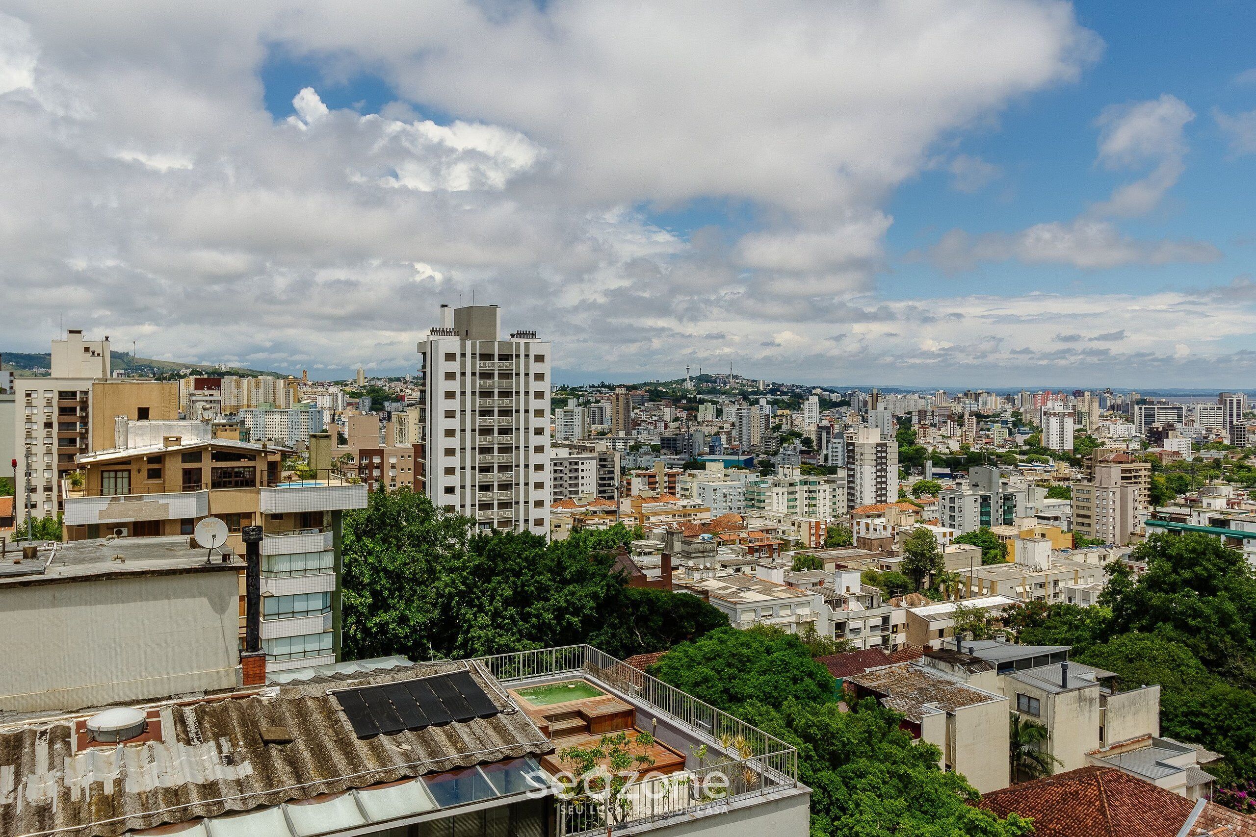 A cityscape with a variety of building heights and styles, including a prominent high-rise building.