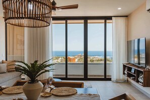 TV, offices - Unforgettable Arch-View Condo • Heated Rooftop Infinity Pool & Ocean Views (Cabo San Lucas)
