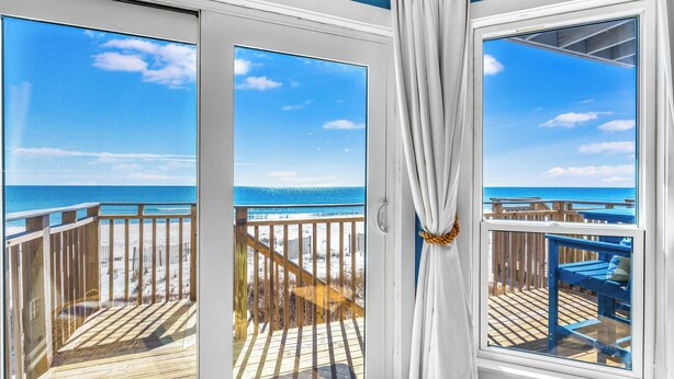 A balcony with a view of the beach and ocean. - Ocean Breeze Beachfront SGI: Relaxing Escape for Families & Couples with Pool (St. George Island)
