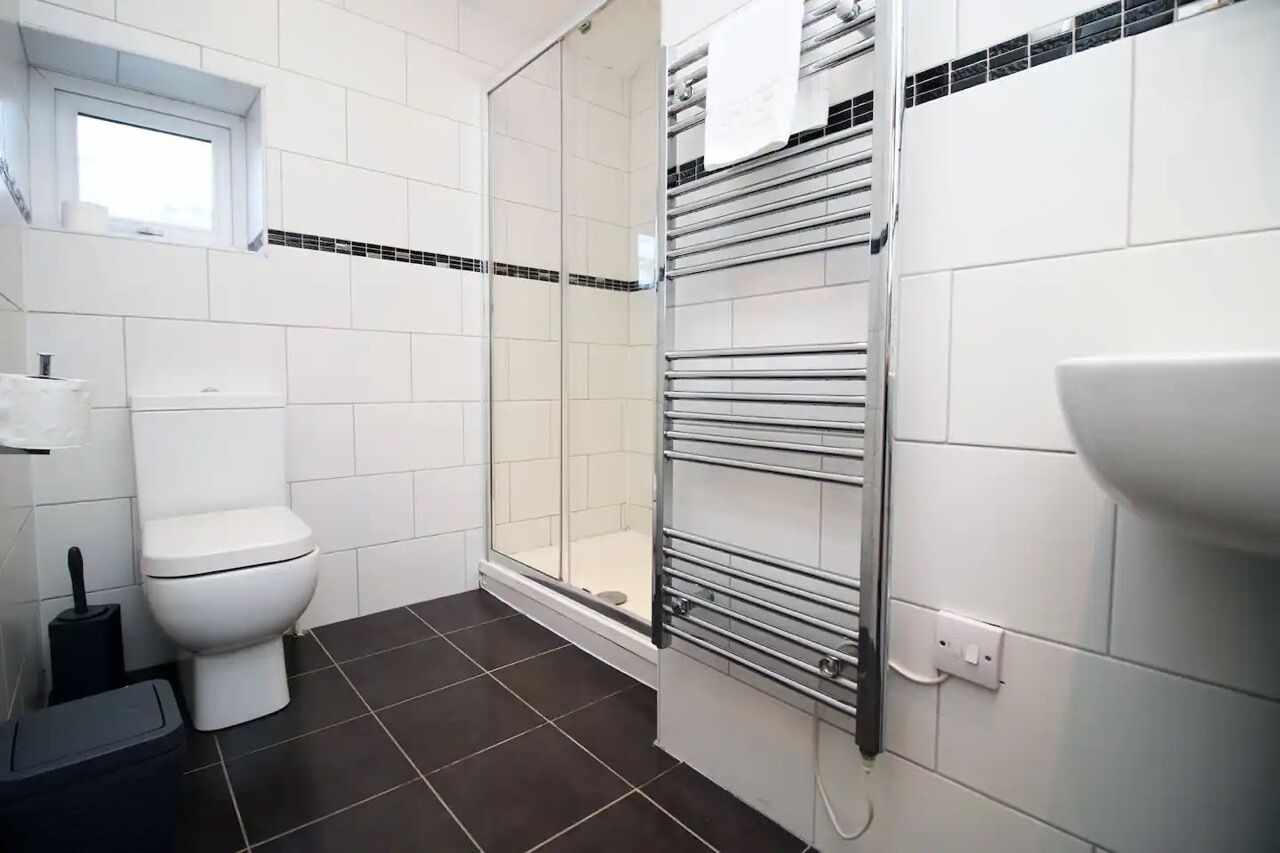Shower, hair dryer, towels, toilet paper