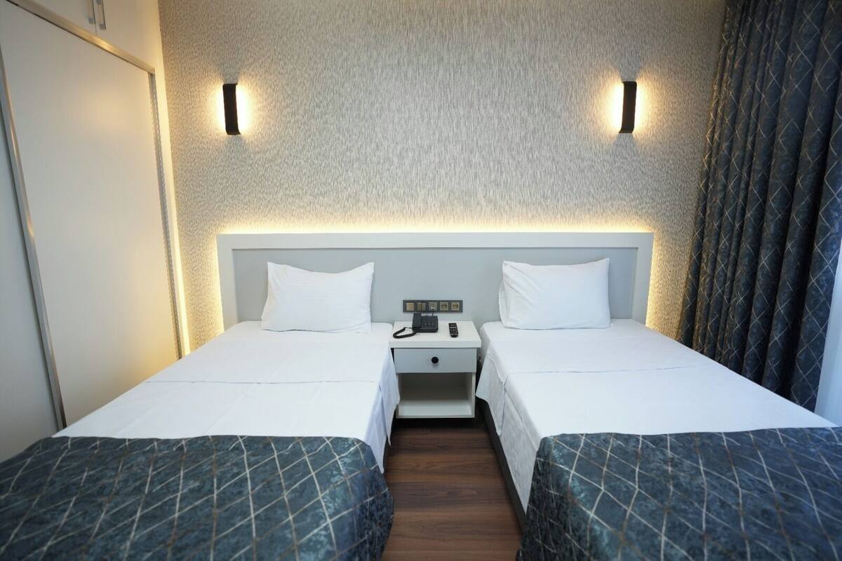 Twin Room, Balcony, City View | Iron/ironing board, free WiFi