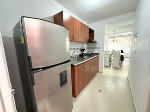 Microwave, stovetop, coffee/tea maker, cookware/dishes/utensils