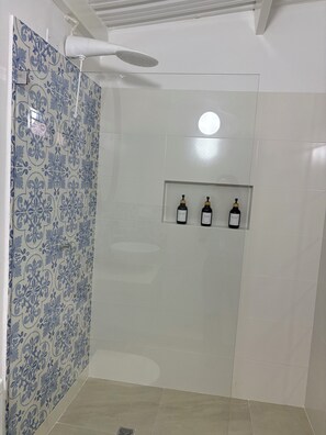 Shower, hair dryer, towels, soap