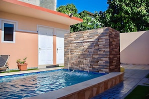 Outdoor pool, open 8:00 AM to 9:30 PM, pool umbrellas, pool loungers