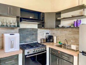 Fridge, microwave, stovetop, coffee/tea maker
