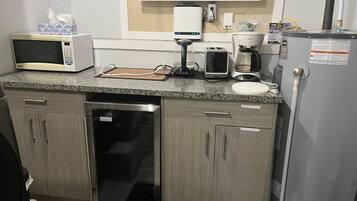 Microwave, coffee/tea maker, electric kettle, cookware/dishes/utensils