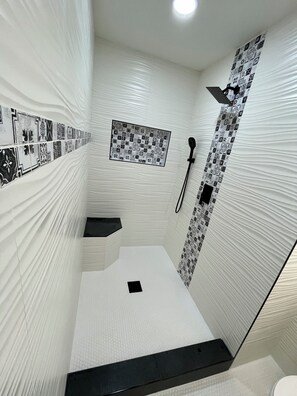 Shower, towels, soap, toilet paper