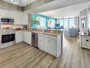 Fridge, microwave, stovetop, coffee/tea maker