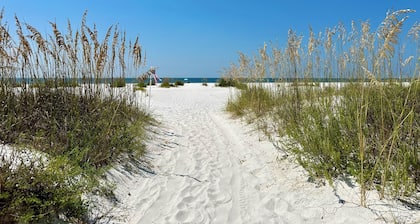 Salty Blue is a new 2BD/2BA cottage, walking distance to restaurants & shops! Pool and fenced yard!