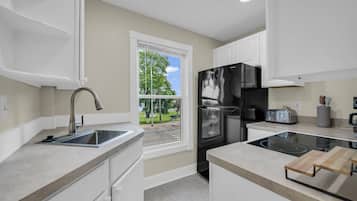 Fridge, cookware/dishes/utensils, spices, dining tables