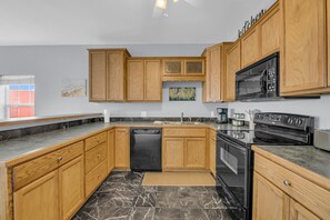 Fridge, microwave, cookware/dishes/utensils, spices